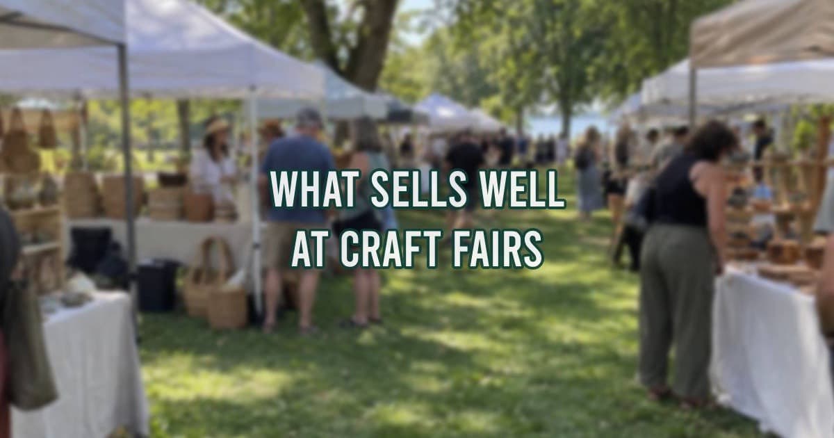 Candles, pottery, and other handmade crafts displayed at an outdoor craft fair